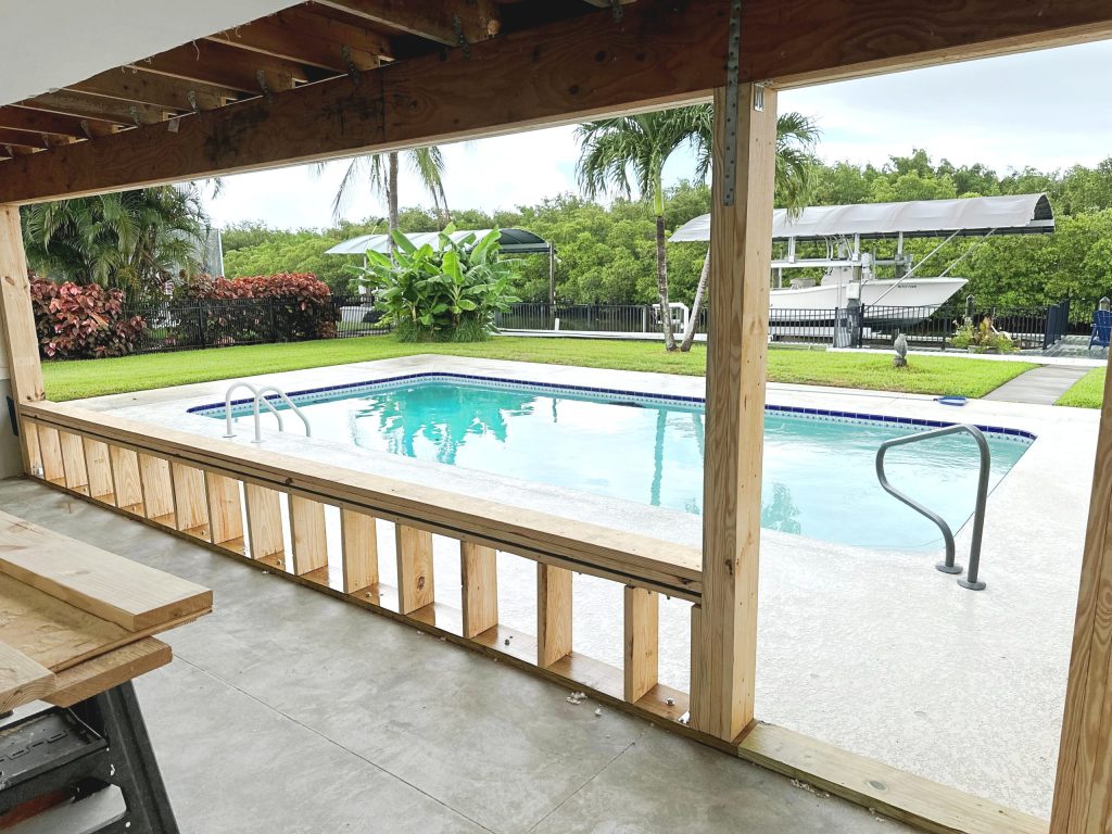 Custom structural porch enclosure conversion using PGT impact glass in Vero Beach