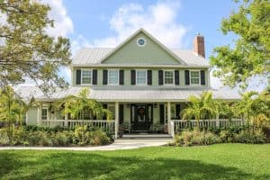 Integrated PGT impact windows entry doors and James Hardie siding installation