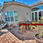 Premium impact sliding patio doors and custom curved window installation on a Stuart Florida home.