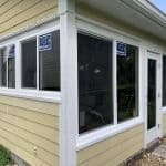 Precise corner installation of PGT impact windows integrated with James Hardie lap siding and custom white PVC trim by db Home Improvements in Stuart Florida.